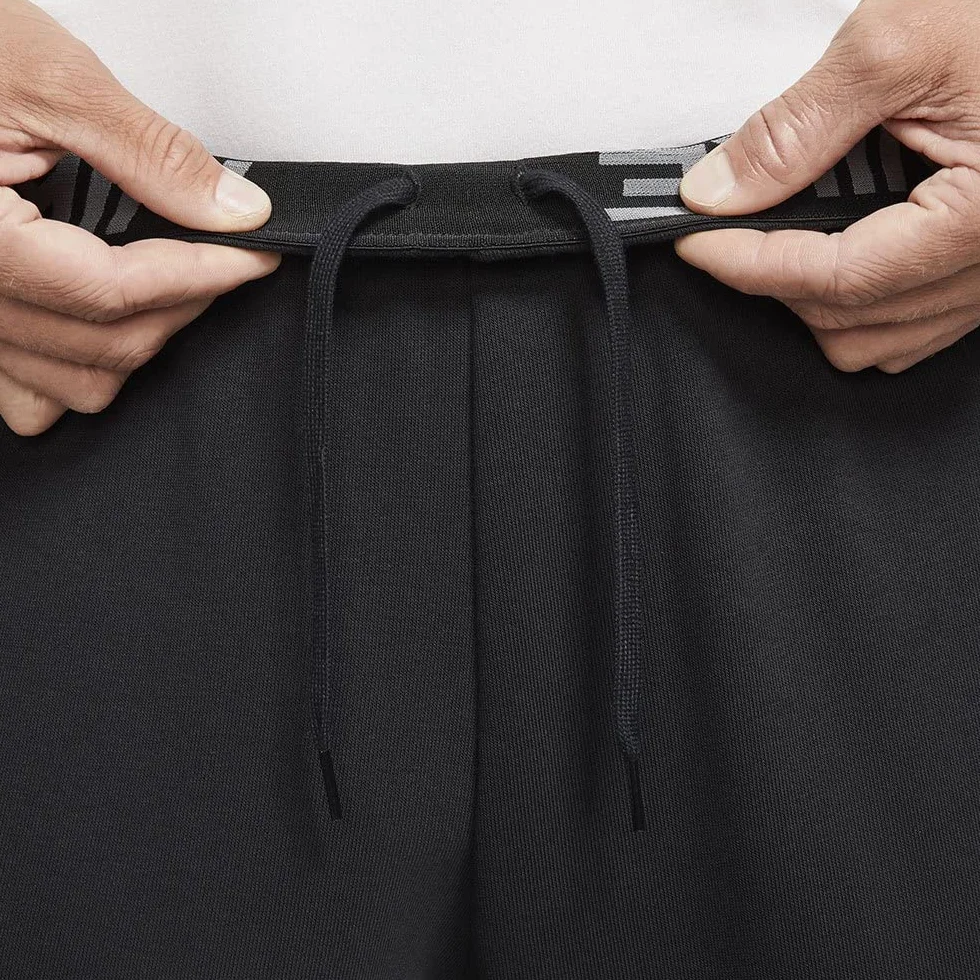 Nike M NK DF PNT TAPER FL - Spodnie kompresyjne Mężczyźni