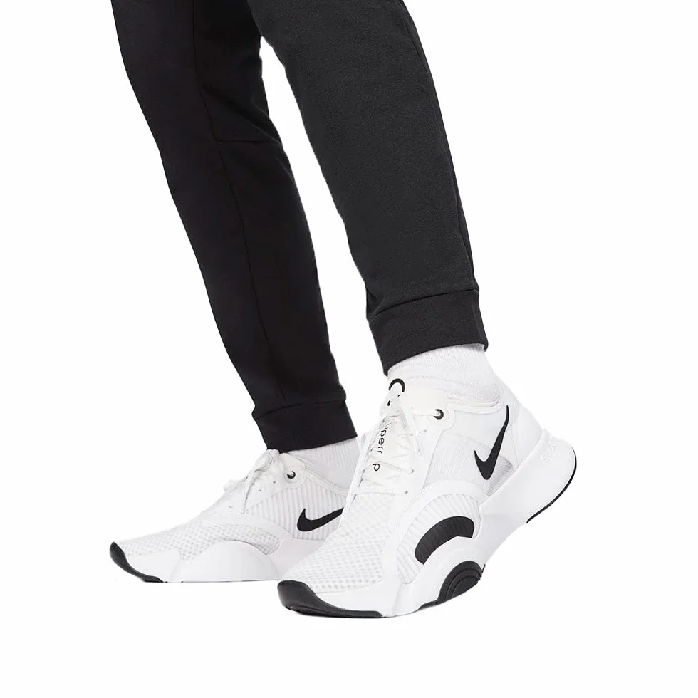 Nike M NK DF PNT TAPER FL - Spodnie kompresyjne Mężczyźni